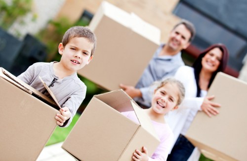 Loading household items into a moving truck in Purley
