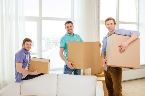 Packed boxes and moving equipment prepared for a Purley relocation