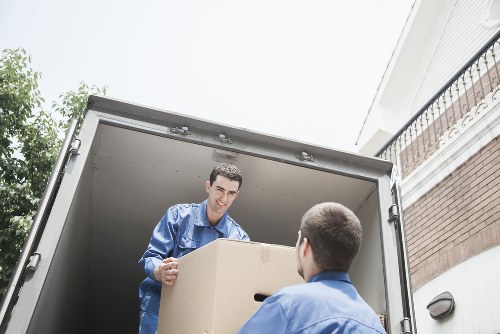 Boxes and furniture being loaded for a house move in Purley