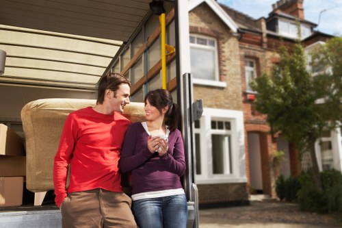 Careful loading of boxes and furniture into a van for a local move