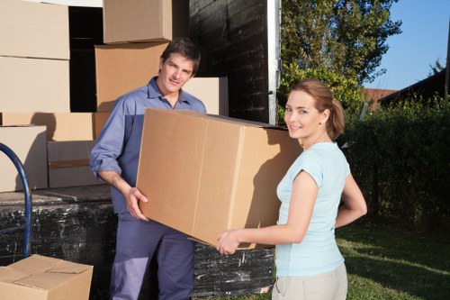 Boxes and furniture being loaded into a removals van