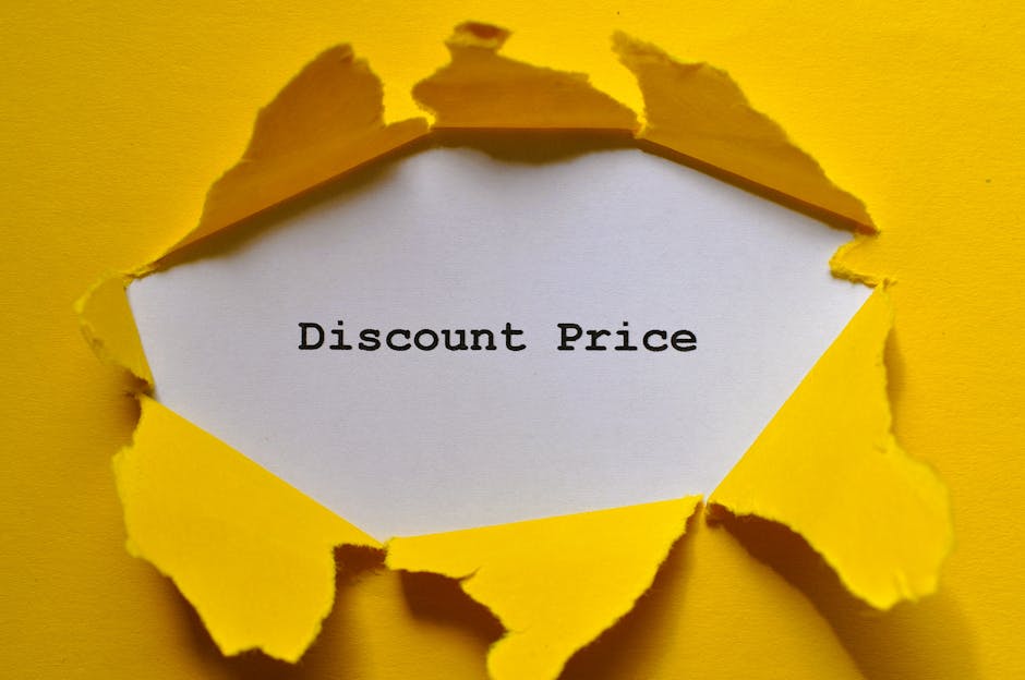 A piece of bright yellow paper has been torn open to reveal a white sheet beneath, displaying the words 'Discount Price' in black typewriter-style font. The torn edges of the yellow paper are jagged and irregular, with some parts curling outward, creating a layered effect. The background is a solid yellow surface matching the torn paper, enhancing the contrast with the white reveal. This visual could relate to promotional offers or discounts associated with home relocation or moving services, emphasizing transparent pricing. The image is evenly lit, with no shadows, and is aligned with themes of packaging, packing materials, or promotional messaging in the context of a house removal or furniture transport. Occasionally, [COMPANY_NAME] may use such visuals to highlight cost-saving or pricing clarity in their relocation process, making it relevant to their service offerings and the context of the page titled 'Confused by Disposal Fees in CR8? Avoid Hidden Costs, PURLEY' on [PAGE_URL].